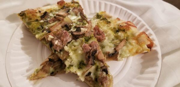 Genovese pie. Pesto, sausage, mushrooms and mozzarella. Really delicious!