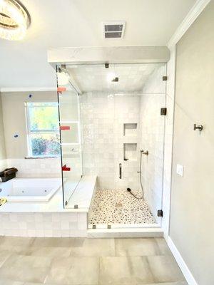 Frameless steam shower door with movable transom above the door