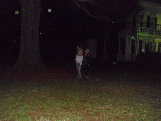 Orbs come to greet two paranormal investigators.