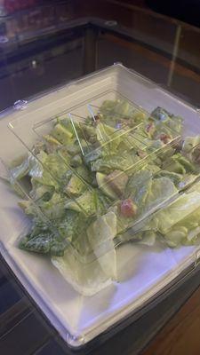 Unopened, tiny portion size for a $14 overpriced salad and when i asked for a little dressing the employee hosed it down then did it again.