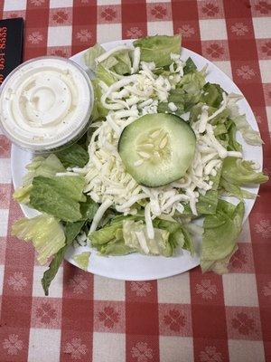 Salad that came with the meal sans onion. One lonely cucumber.