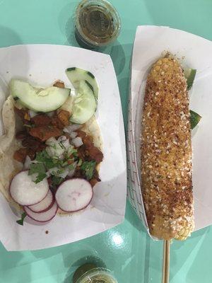 Elote and carne taco on flour tortilla