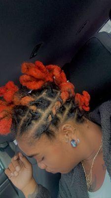 Orange/pink locs in a fohawk