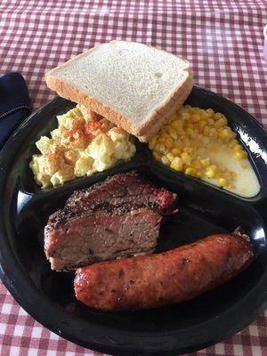 Potato salad, creamed corn, brisket and sausage link