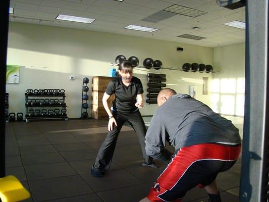 Jennifer coaching dynamic movement one on one.