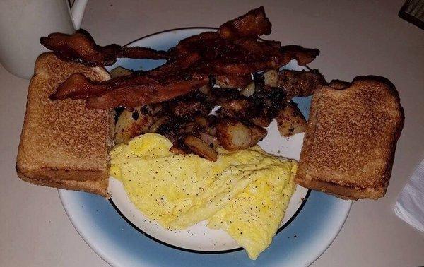 2 scrambled eggs, home fries with onions, bacon an wheat toast. Coffee.