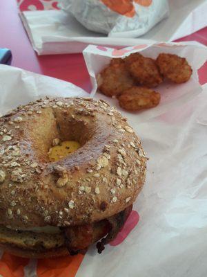 Multigrain bagel with hash browns.