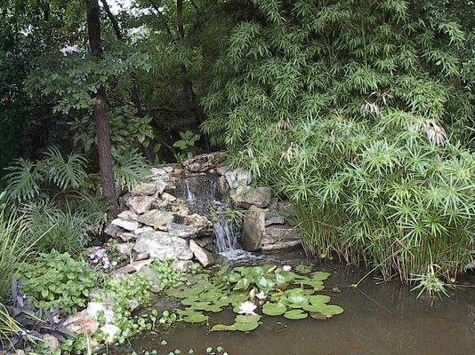 A lush, green yard and a softly splashing water feature, like this one we installed, add beauty and value to your home. landscape123.com