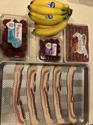 Sprouts bacon, breakfast sausage, strawberries, raspberries and bananas