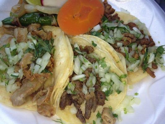 Three different tacos.  And one puny slice of lime to make them all happy.