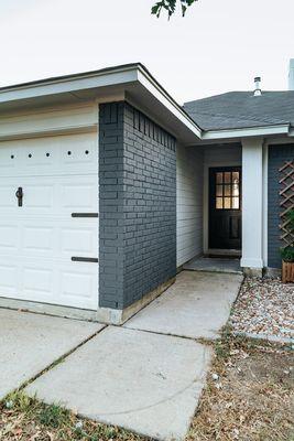 Exterior painting of brick home