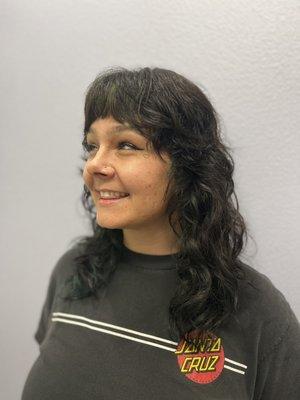 A curly shag with textured bangs