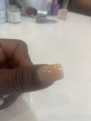 Uneven nail that wasn't filed.