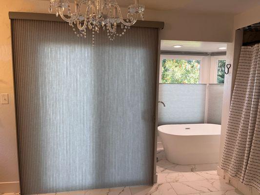 Elevate your bathroom sanctuary with sleek window blinds that infuse warmth and style while maintaining your privacy.