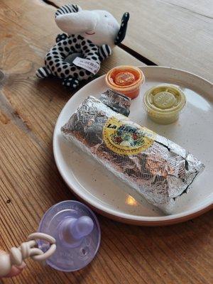 Tiny jackfruit burrito (infant pacifier included for size reference)