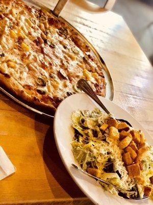 Caesar salad and thin crust cheese pizza with jalapeños and pineapple.