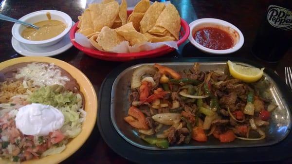 Lunch Fajitas with side of spicy salsa.