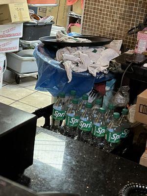 Dirty rags, dirty dishes and general filth behind the checkout register and into the kitchen.