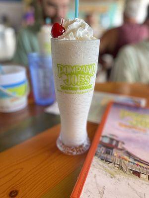 Piña Colada in the souvenir Pilsner cup.