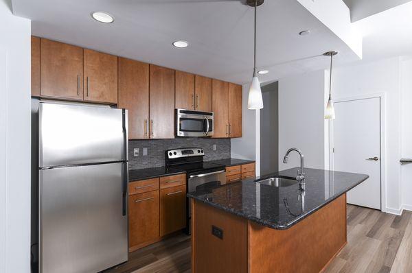 Open Layout Kitchen with Granite Countertops