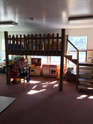 Our pre-k room loft can be a quiet place to look at a book upstairs, or a great place to play "family" underneath.