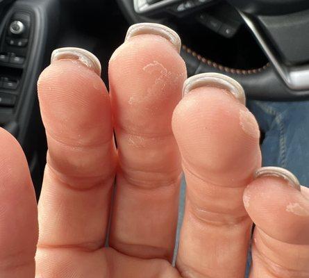 Nail glue left on the the fingers and he didn't grind under the nails.