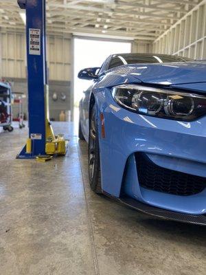 Front view of an F82 M4 that received some upgrades including downpipe, intercooler and charge air pipes