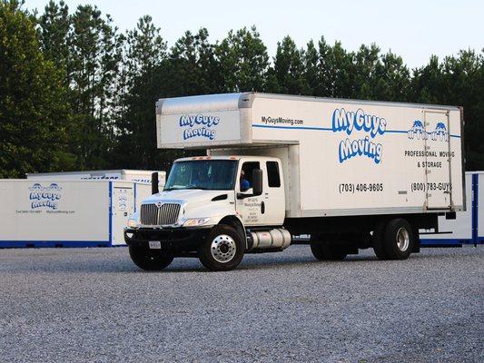 Moving truck in lot with storage units