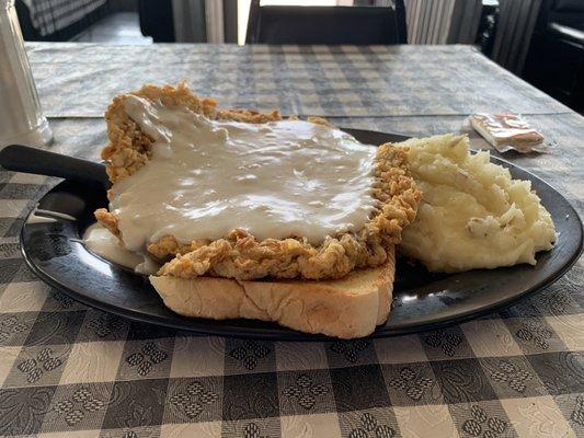 Chicken fried steak and mashed potatoes.