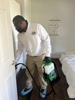 Pest control technician accounting for every "nook and cranny" on the interior