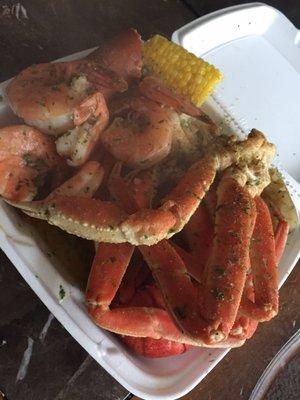 Crab, shrimp, potatoes, lobster, and corn.