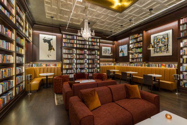 The lounge area houses almost 10,000 books and fine art from Rashid Johnson, Robert Longo, and Roy Lichtenstein, among others.