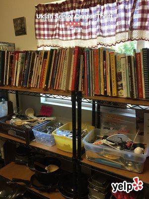 Cookbooks displayed in cookware section.