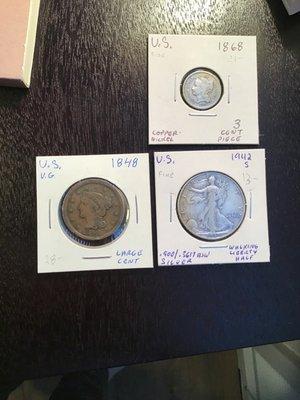 An old 1848 penny ,walking liberty half dollar, and A three cent piece