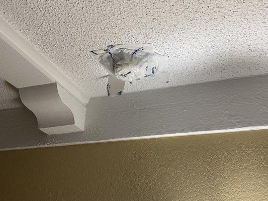 Tape over what I believe is the smoke detector