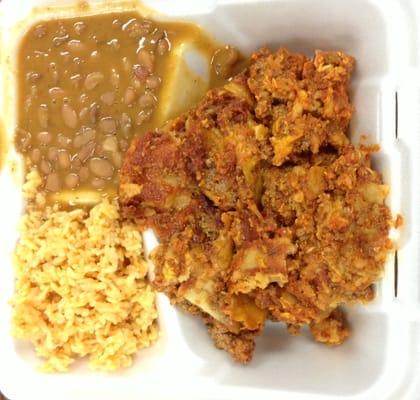 Enchiladas with rice and beans. Enchiladas look like someone dropped the tray on the floor and scooped them up. Tasteless too.