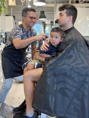 Juan cutting my son's hair