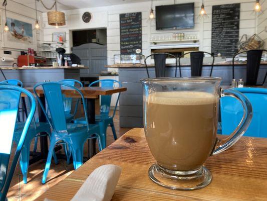 Coffee with steamed milk in glass mugs.