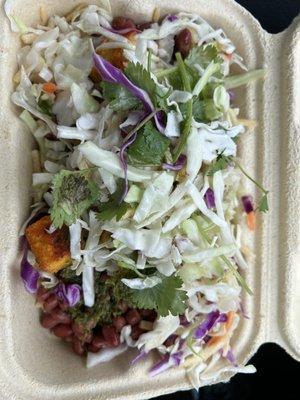 Tofu rice and bean bowl with red beans, yellow rice, Latin slaw, chimichurri sauce.