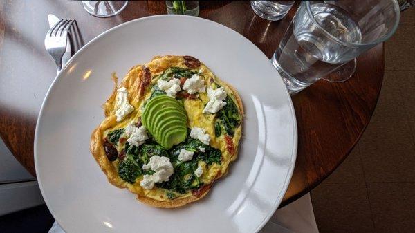 Vegetarian dish, avocado, spinach, brie, black olives, and sundried tomatoes