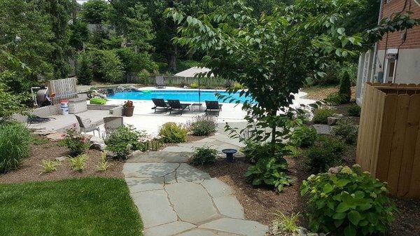 Pool area landscape, flagstone walkways and stone steps.