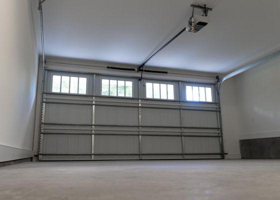 Garage door Installation with a new opener, spring and cable