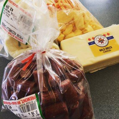 A small sampling of today's purchase: fresh curds, fresh string cheese, mild brick cheese and beef stick bites