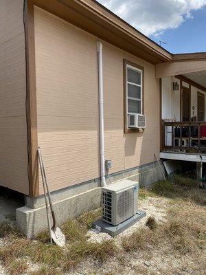 Replacing that old window shaker AC with a high-efficiency heat pump mini split.