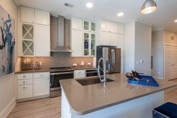 Beautiful, spacious kitchen with floor-to-ceiling cabinets and floating island