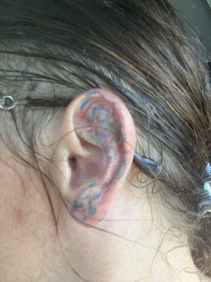 The "subtle" ear tattoo. No where near the design I drew or colors I requested.