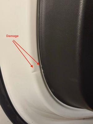 Crease in door and damage to interior panel