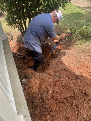 Chase digging a hole to find water pipe that ends up to be 47 inches below ground