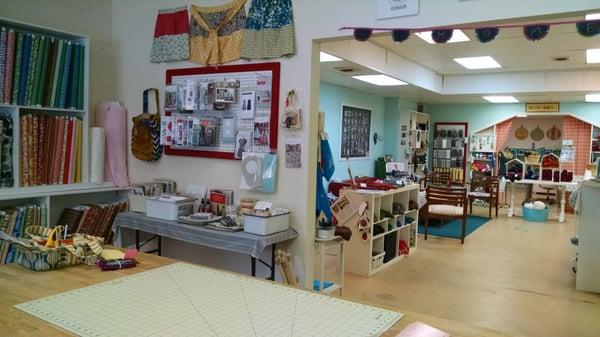 Space for sewing lessons, a cafe, a couch area for needlework, and a back room for all the crafts your heart desires!