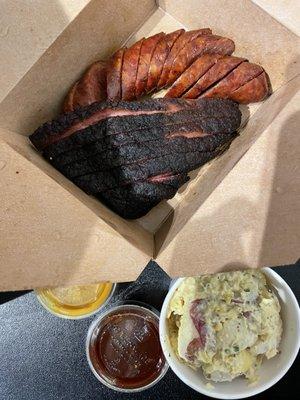 1/2 lb brisket & 1 hot link ($7). Small potato salad